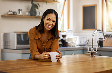 Image showing Happy portrait, coffee and woman at house in a kitchen with a hot drink feeling relax and calm in the morning. Happiness, zen and young female smile in a home with a mug in a household with tea