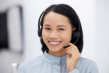 Image showing Asian woman, call center and smile in portrait, communication and CRM, headset with mic in office. Contact us, customer service or telemarketing agent with happy female consultant and help desk