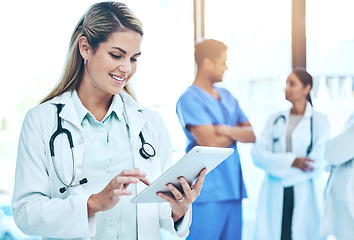 Image showing Woman doctor on tablet for medical research, hospital employees management or telehealth services check. Professional healthcare worker or manager working on digital technology or clinic workflow app