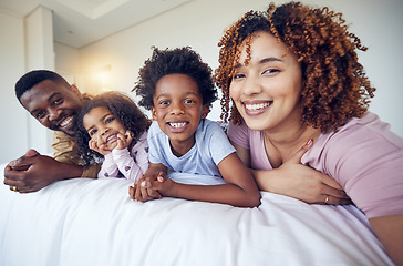Image showing Portrait, selfie and happy family relax in bed, smile and cheerful in the home during morning together. Face, photo and children resting indoors with parents and pose for profile picture and memory