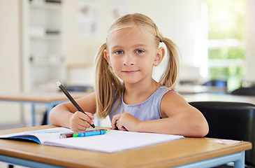 Image showing Education, drawing and portrait of girl in classroom learning, exam or studying with book. Preschool, development or confident kid or student from Canada with creative art in notebook in kindergarten