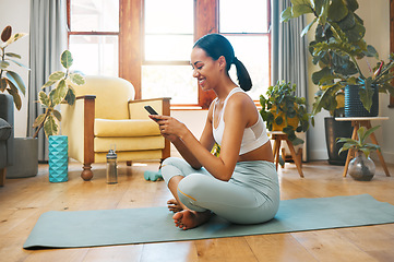 Image showing Home, phone or happy woman on social media for yoga content for wellness, fitness or healthy lifestyle. Mobile app, meme or girl smiling online after exercise, workout or training in house studio