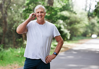 Image showing Senior man, exercise and outdoor with music earphones for run, workout and training on road for fitness. Elderly male person happy about cardio audio for health and wellness or walking and running