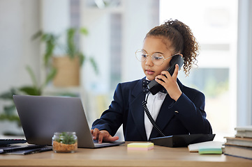 Image showing Kids, telephone and a girl playing in an office as a fantasy businesswoman at work on a laptop. Children, phone call and a female child working at a desk while using her imagination to pretend