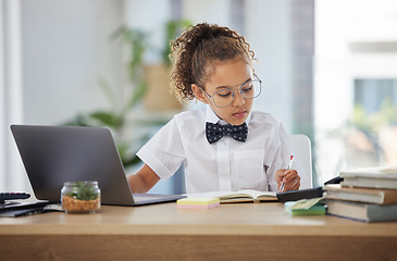 Image showing Business, writing and child play pretend with laptop, notebook and planning for imagination career, learning or education. Focused professional kid or girl with dream job, game or working on computer