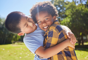 Image showing Happy, children or friends hugging in park together for fun, bonding or playing in sunny summer. Portrait, diversity or excited young boy best friends smiling or embracing on school holidays outside