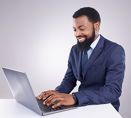 Image showing Happy black man, business and laptop in studio for planning, corporate research and internet. Male employee, computer typing and background for website connection, online stocks and digital trader