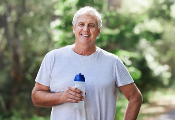 Image showing Man, exercise portrait and outdoor with water bottle for run, workout and training for fitness. Senior male happy for hydration, cardio health and wellness while running in nature and retirement