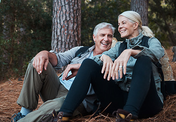 Image showing Nature, smile and hiking, old couple on floor in forest in South Africa on retirement holiday adventure. Travel, senior man and woman relax together on outdoor walk with love, happiness and health.