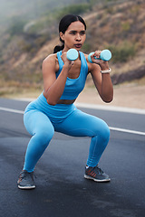 Image showing Fitness, outdoor and woman doing a exercise with weights for strength, wellness and health. Sports, cardio and young female athlete doing a workout or training with equipment in nature in the road.