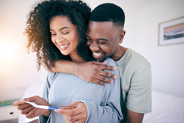 Image showing Pregnancy test, hug and black couple in a home with a smile from baby news. Support, care and happy parents with a young and new mother and dad together feeling love with pregnant woman in bedroom