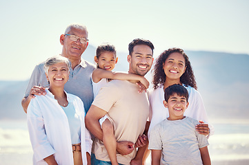 Image showing Big family, portrait of grandparents and kids with parents, smile and happy bonding together on ocean vacation. Sun, fun and happiness for generations of men and women with children on beach holiday.