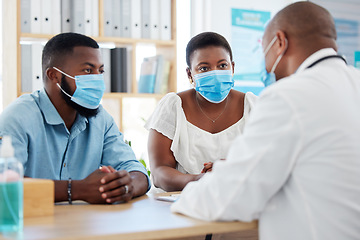 Image showing Covid, healthcare and doctor consulting a married couple in a hospital for insurance or treatment. Medical, health or trust with a medicine professional talking to a man and woman in a clinic