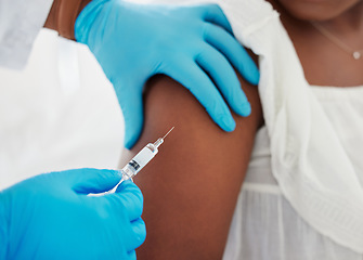 Image showing Hand, covid vaccine and a patient closeup with her doctor in a hospital for an injection of medicine antibiotics. Healthcare, medical and consulting with a healthcare professional holding a syringe