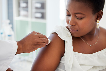 Image showing Doctor wipe the patient arm before a vaccine in a consultation room in the hospital. Healthcare, hygiene and hand of medical worker cleaning the skin before an injection in a medicare clinic.