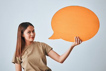 Image showing Speech bubble, smile and portrait of woman in studio isolated on a white background. Social media, poster and happy girl with billboard for voice, opinion or branding, marketing or advertising space.