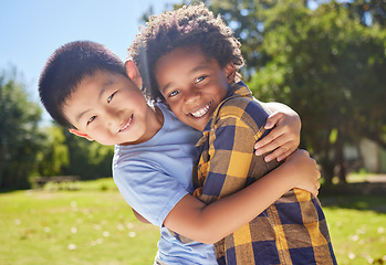 Image showing Portrait, children and friends hugging in a park together for fun, bonding or playing in summer. Hug, kids and diversity with boy best friends embracing in a garden in the day during school holidays