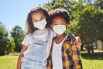 Image showing Children hug, park and mask for covid in portrait with support, care or outdoor in summer sunshine. Kids, friends and embrace with girl, safety and solidarity at school, playground and backyard lawn