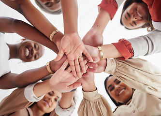 Image showing Team, business people and hands together, solidarity and support, low angle and collaboration in meeting. Teamwork, trust and community with diversity, female group and happy women with hand stack