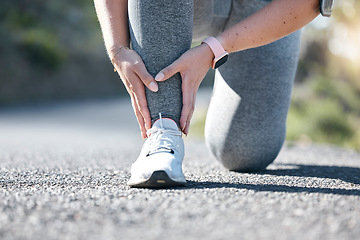 Image showing Running, fitness and ankle injury with a woman on the street during a cardio or endurance workout. Medical, pain and accident with a female runner outdoor on a road for health, sports or training