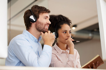 Image showing Man, woman and call center training at computer with notebook, helping hand or thinking together. Crm teamwork, tech support or learning for customer experience with diversity in office with notes