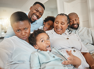 Image showing Funny, goofy and selfie of black family make joke with faces in a home or house while on vacation or holiday. Social media, mother and father with children and grandparents happy bonding with humor