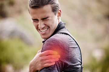 Image showing Sports, injury and man with pain in shoulder outdoors after exercise, training and workout in nature. Fitness, medical emergency and male athlete with joint inflammation, muscle ache and tendinitis