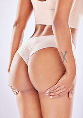 Image showing Butt, woman beauty and self care in a studio with wellness, underwear and fitness. Beauty cosmetics, liposuction and cellulite treatment of a female with skin glow with isolated white background