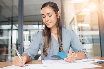 Image showing Business woman writing documents at office desk of administration, strategy solution or project notes. Female worker planning paperwork, ideas or management of professional company reports in startup