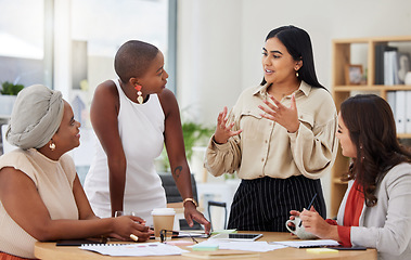 Image showing Diverse group, teamwork and young business women brainstorming, collaboration or cooperation. Ambitious confident professional team of colleagues talking and planning a marketing strategy together