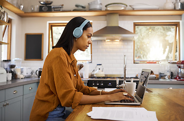 Image showing Laptop, remote work and a woman with focus music, typing email and working on a proposal. Serious, headphones and a freelance worker with a computer for home business, budget and finances online