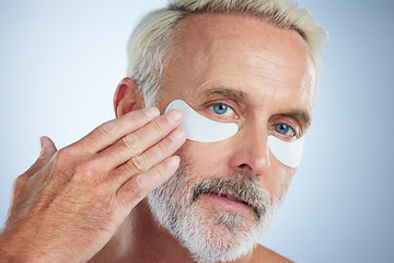 Image showing Beauty, mask for eyes and portrait of old man in studio for wellness, facial treatment and anti aging cosmetics. Skincare, dermatology and face of male with pads for wrinkles, grooming and health