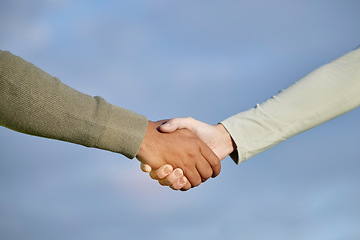 Image showing Handshake, agreement and people teamwork, partnership and collaboration for support, onboarding and b2b on blue sky. Woman with partner shaking hands together for welcome, thank you or deal on mockup