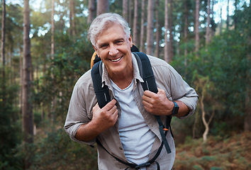 Image showing Happy, hiking and portrait of old man in nature for relax, trekking and adventure. Travel, wellness and vacation with senior male walking in forest for retirement, backpacking and cardio endurance