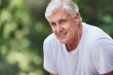 Image showing Senior man, exercise and outdoor with music earphones for run, workout and training for fitness. Elderly male happy on break, rest and tired thinking of cardio audio for health and wellness in nature