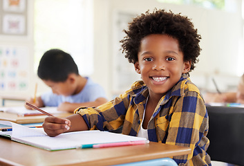 Image showing Education, drawing portrait or boy child in classroom learning, exam or studying with preschool notebooks. Development or kids or happy student with creative art writing for knowledge in kindergarten