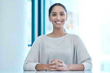 Image showing Happy, corporate and portrait of a woman at a table for a meeting, interview or management. Smile, executive and an employee sitting at a desk for administration, secretary work and human resources