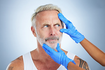 Image showing Needle, confused face and senior man in a studio doing plastic surgery and cosmetic skincare. Dermatology gloves, wrinkles and anti aging treatment of a mature model prepare for medical procedure