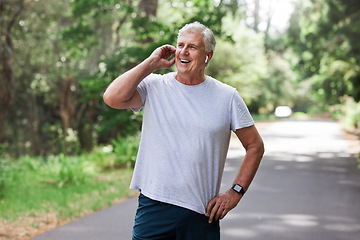 Image showing Happy, talking and man on a phone call while running, speaking about fitness and exercise in nature. Thinking, smile and a senior person laughing on a mobile while in a park for cardio and workout