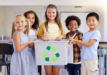 Image showing Children, recycle bin and portrait in classroom for cleaning, climate change or eco friendly in school. Recycling, learning and education smile with happy group of students or friends in kindergarten