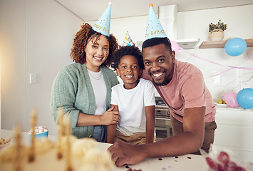 Image showing Birthday, party and portrait of family in kitchen for celebration, bonding and affectionate. Happiness, excited and care with parents and child at home for surprise, fun and special event