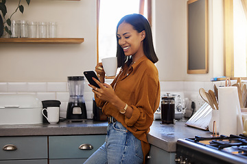 Image showing Coffee break, phone and woman standing in kitchen while browsing internet, checking social media or reading email. Chat, connect and relax, resting and latino female in apartment on a break