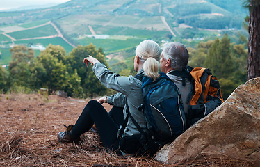 Image showing Mountains, retirement and hiking, old couple pointing at mountains in view on nature walk in Peru. Travel, senior man and woman relax on mountain cliff, hike with love and health on holiday adventure
