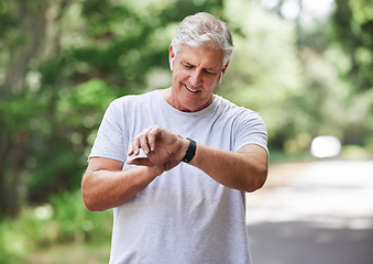 Image showing Senior man, watch and outdoor for exercise time to run, workout and training on road for fitness. Elderly male person happy about cardio progress for health and wellness while running in summer
