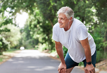 Image showing Senior man, outdoor and rest with music earphones for run, workout and training on road for fitness. Elderly male person happy and tired of cardio for health and wellness with audio for running