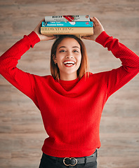 Image showing Reading, student and woman with books on her head while studying in college for a test or exam. Thinking, thoughtful and young female with stories, novels or fiction standing by a wall in the library