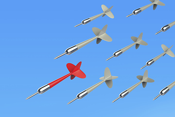 Image showing Many flying darts against blue sky