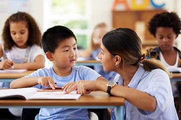 Image showing Teacher, learning and helping boy in classroom for knowledge, studying or assessment. Preschool, development and Asian kid or student with woman for education assistance with notebook in kindergarten