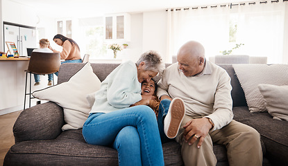 Image showing Tickle, laughing and child with grandparents on sofa of living room for bonding, happy family and playful. Tickling, boy and fun with senior people at home for happiness, generations and funny game