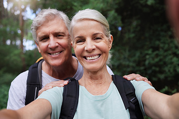 Image showing Selfie, hiking and portrait of senior couple with smile on adventure in forest, woods and mountain for exercise. Fitness, retirement and happy elderly man and woman take picture trekking for wellness